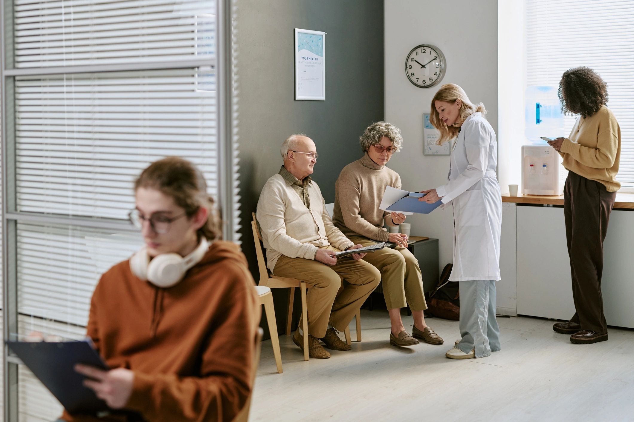 Doctor consulting with patients in a clinic