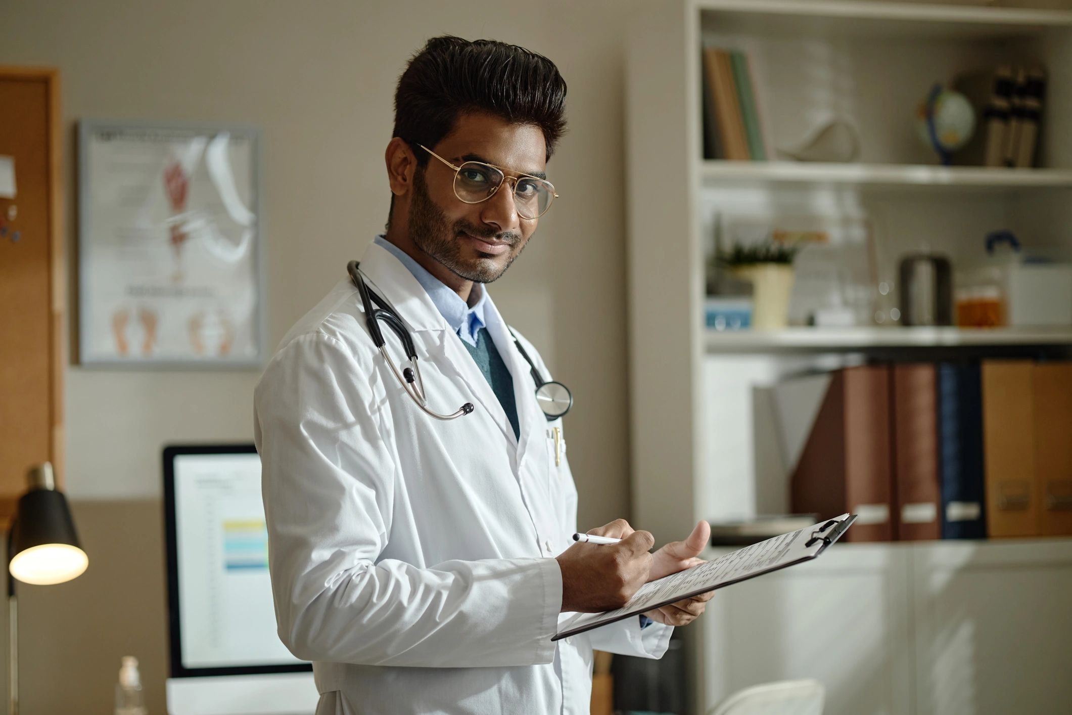 Doctor reviewing patient notes in clinic