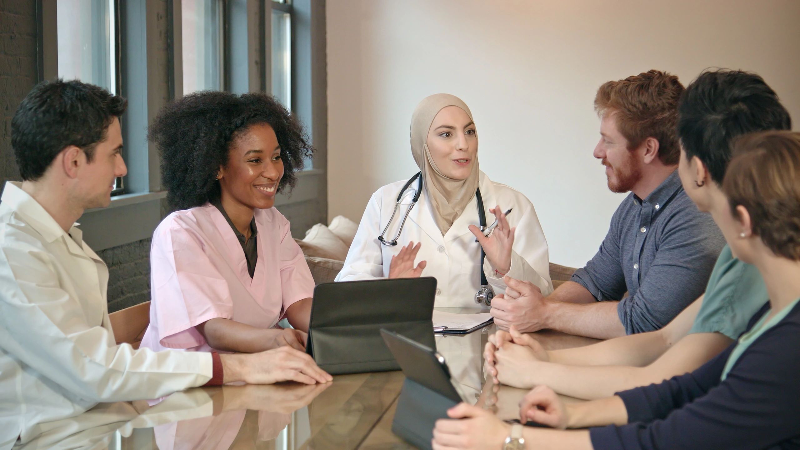 Doctor meeting with healthcare professionals
